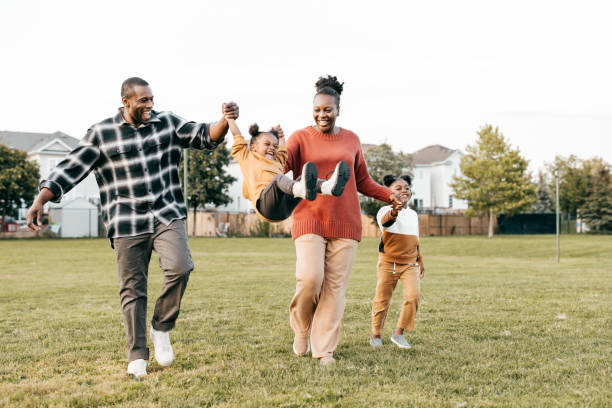 family having fun on soccer field