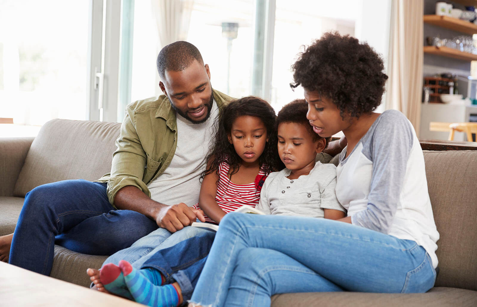family sitting on the couch together