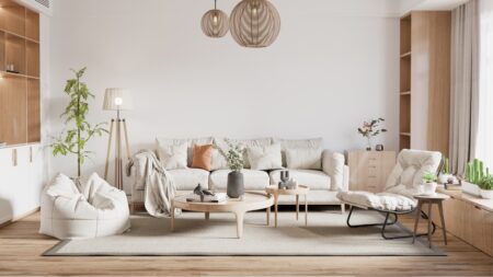 Residential cleaning team preparing a tidy, refreshed living room for homeowners.