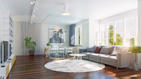 Residential cleaning team maintaining a spotless open-concept living space.