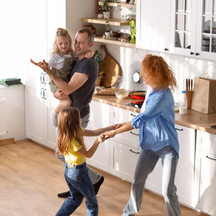 family dancing in the kitchen after an amazing house cleaning service in Oakland, CA