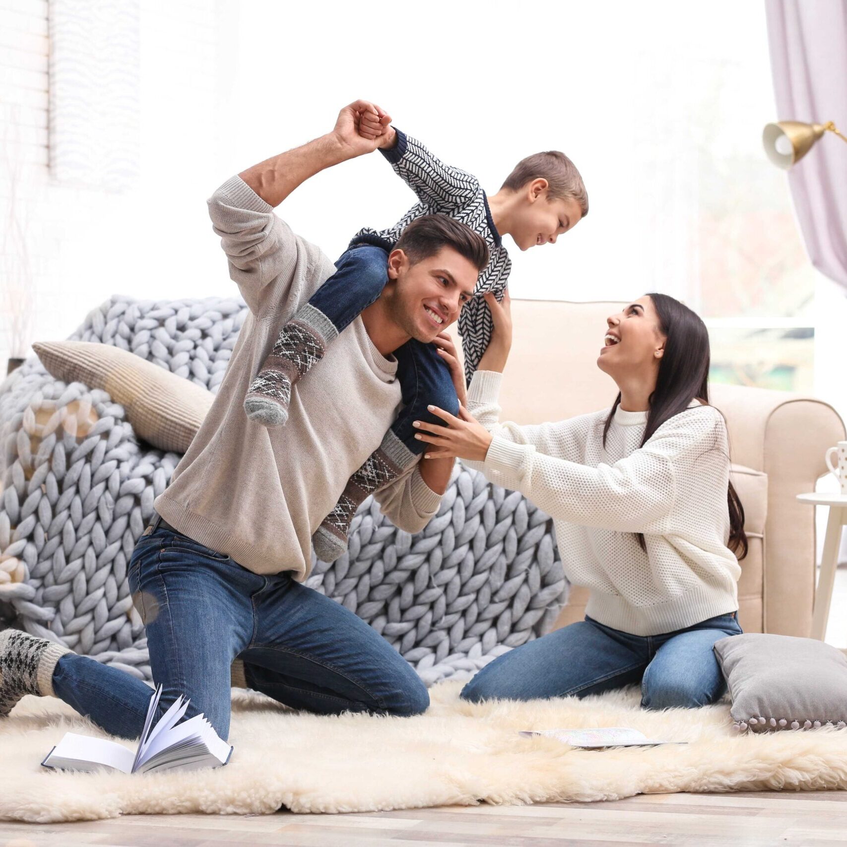 family enjoying time together in their living room after our house cleaning services in Berkeley